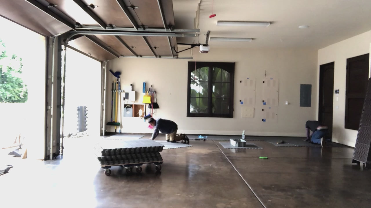 Load video: installation video of fitness flooring in garage